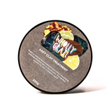 Image of label and lid of soft clay treatment on an angle and on white background